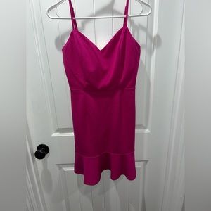 Pink dress.Adjustable straps.Size 7/Tight fit with flare ruffles at the bottom.